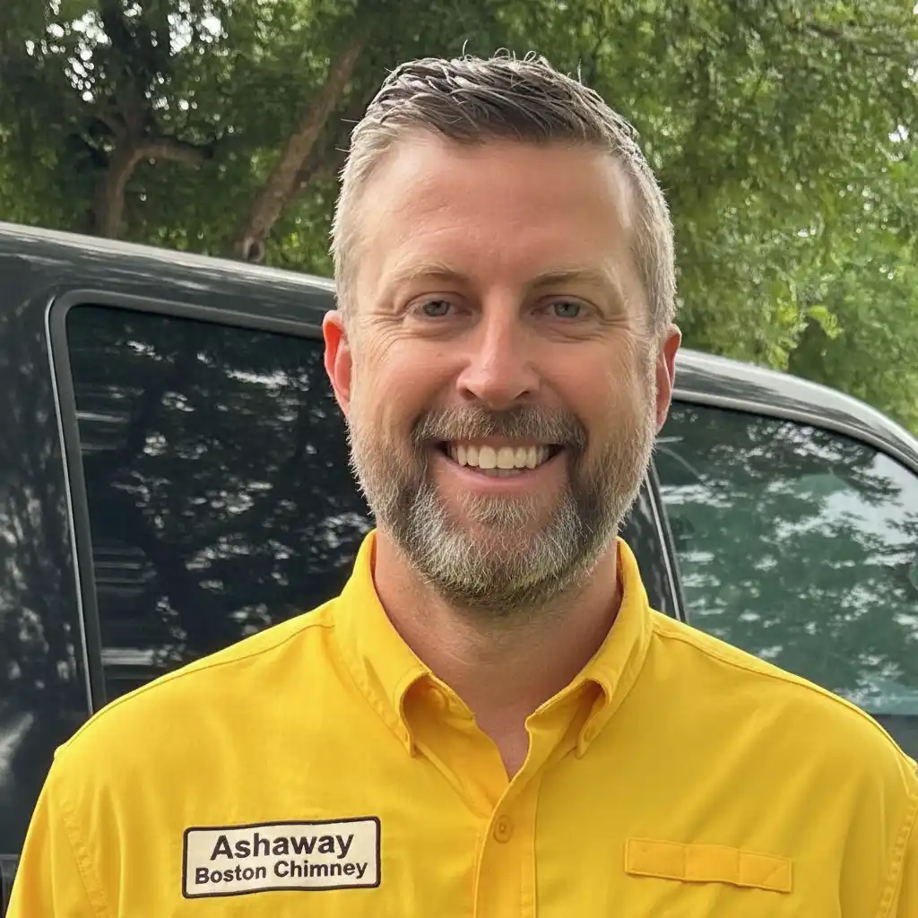 Dylan Mitchell, owner of Ashaway Boston Chimney, wearing company uniform